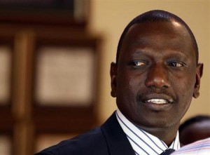 Former Kenyan Cabinet Minister Ruto stands inside his house after hearing the news from the International Criminal Court, in Nairobi