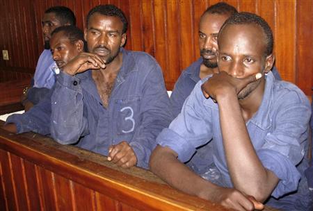 Suspected Somali pirates stand in the dock inside a courtroom in the Kenyan coastal town of Mombasa