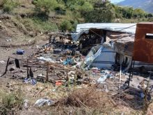 Torn tarpaulin shelters, broken poles and scattered belongings on a hillside at the Jari camp for displaced people near Hayk, South Wollo.
